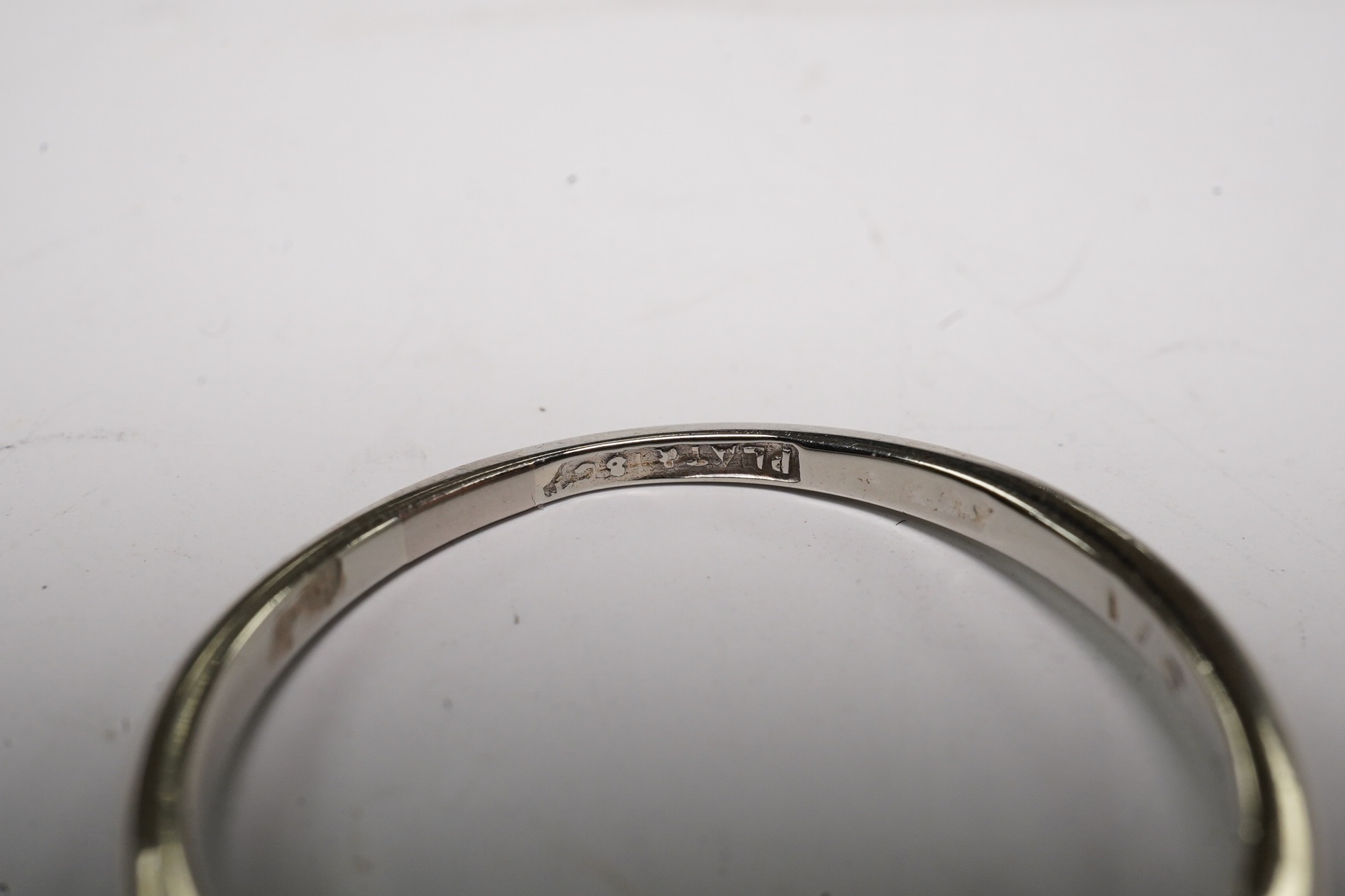 An 18ct, plat and two stone diamond set crossover ring, size O, gross weight 2.3 grams, Condition - fair to good